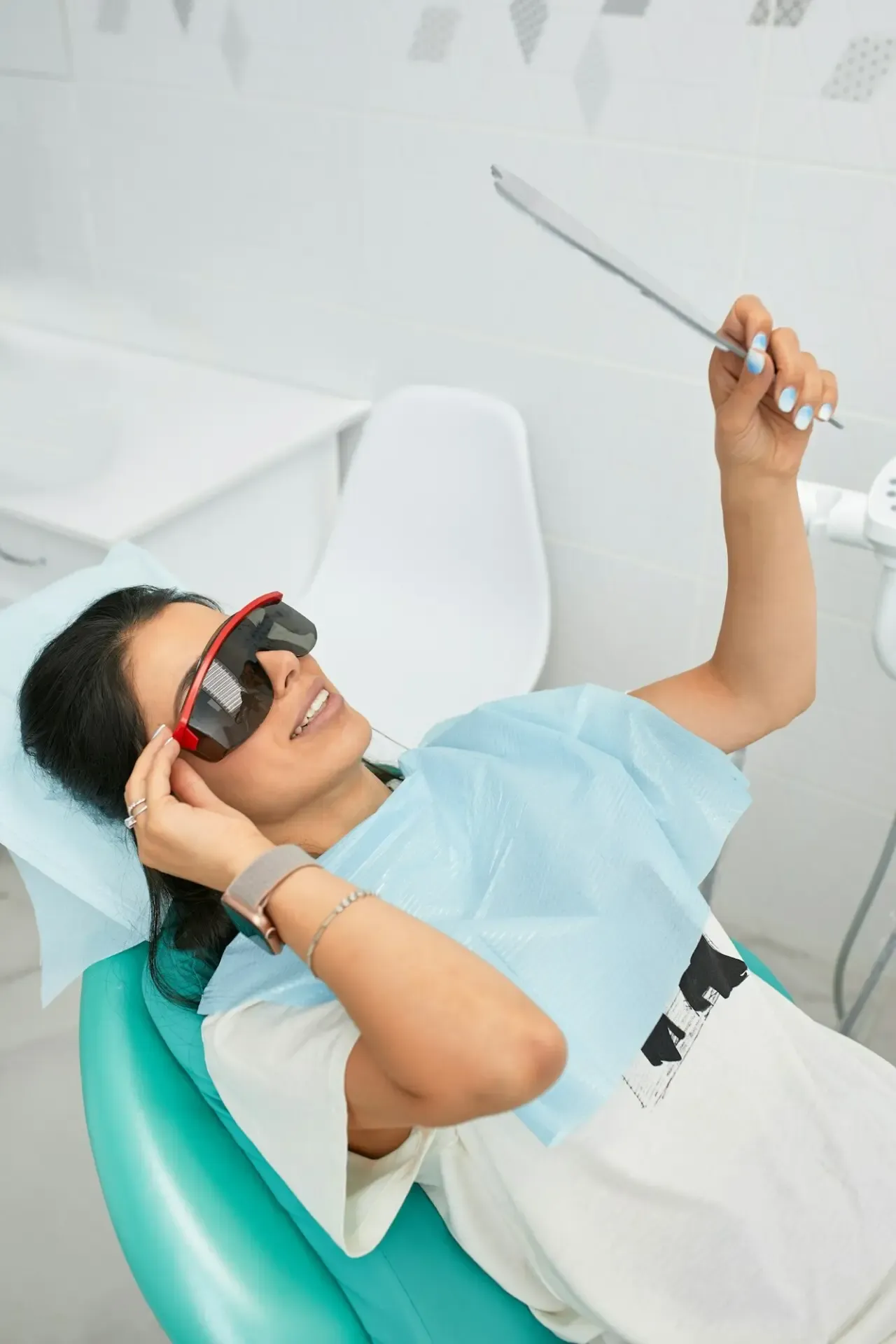 A woman in the dentist's chair during a dental procedure