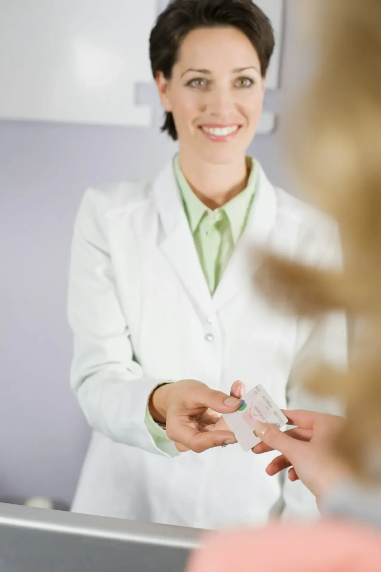 A patient paying for dental treatment